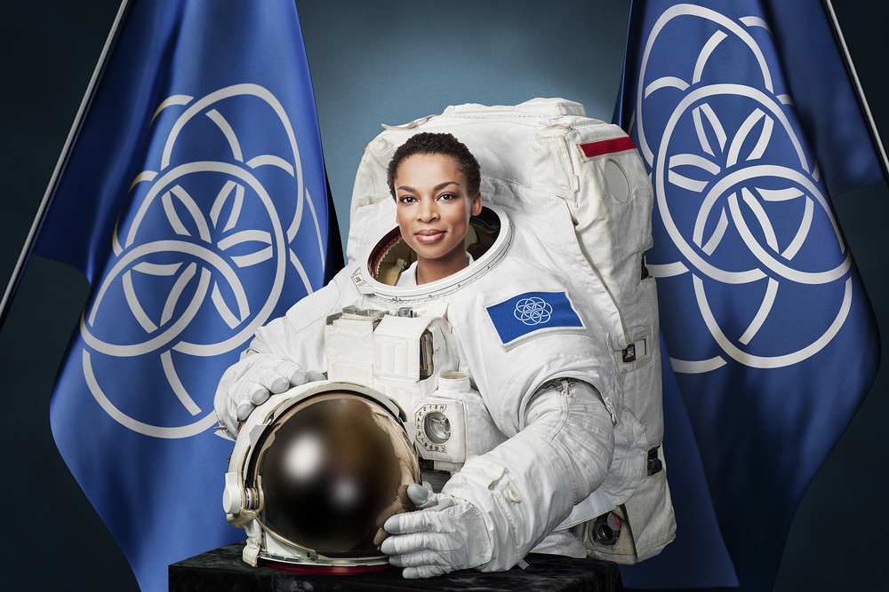 patriotic cosmopolitanism - astronaut with international flag of planet earth designed by Oskar Pernefeldt